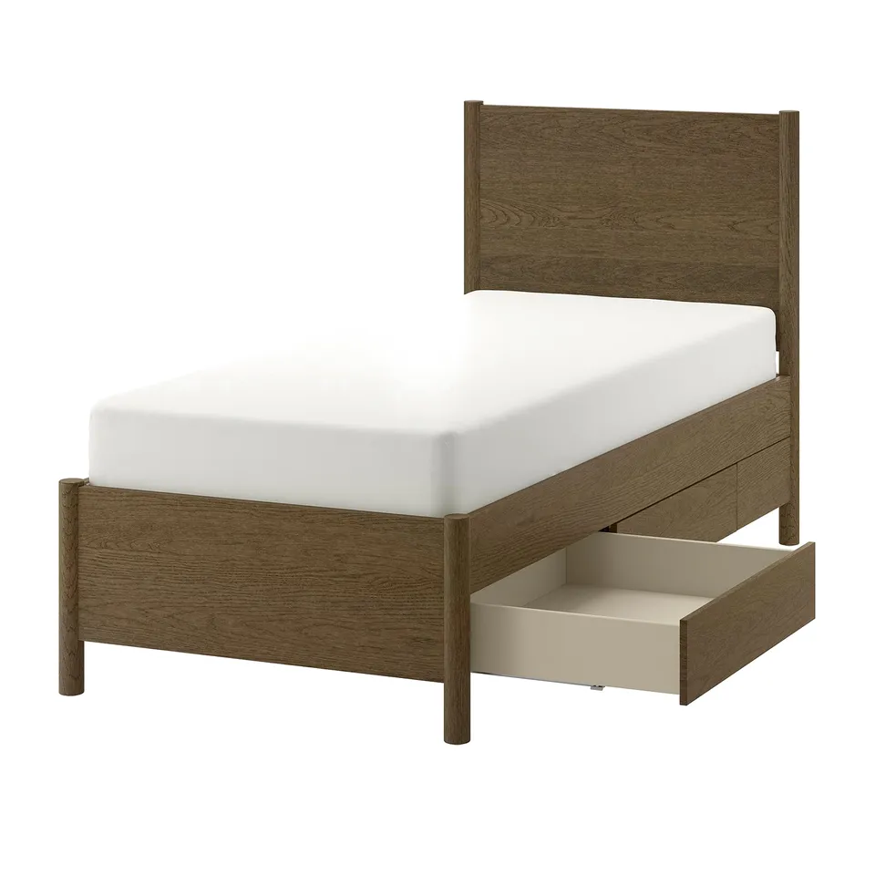 A TONSTAD bed frame in oak veneer with a classic design. It two soft-close drawers and a sturdy, adjustable slatted base.