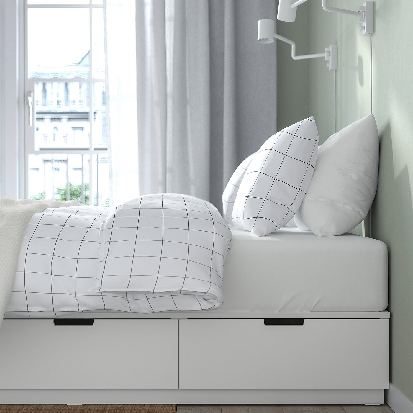 Modern bed with drawer storage, clean bedding, urban view.