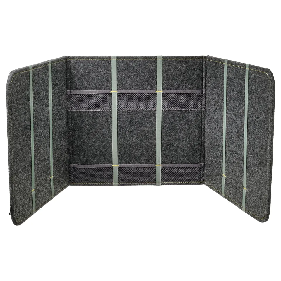 A grey ÖVNING desk divider, a versatile and portable privacy screen with multiple panels, pockets, and elastic straps for organisation.
