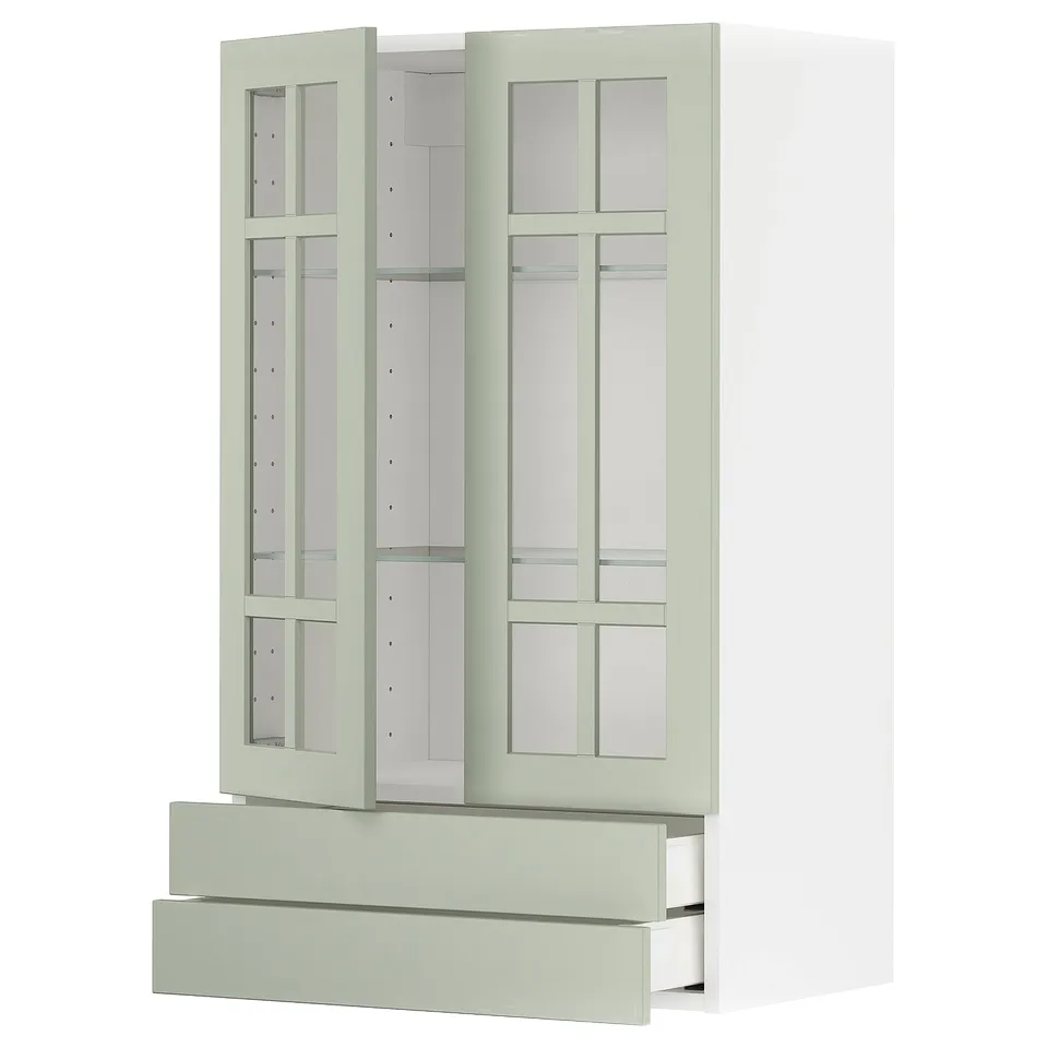 METOD kitchen unit with green glass doors, light green drawers, and toughened glass shelves.