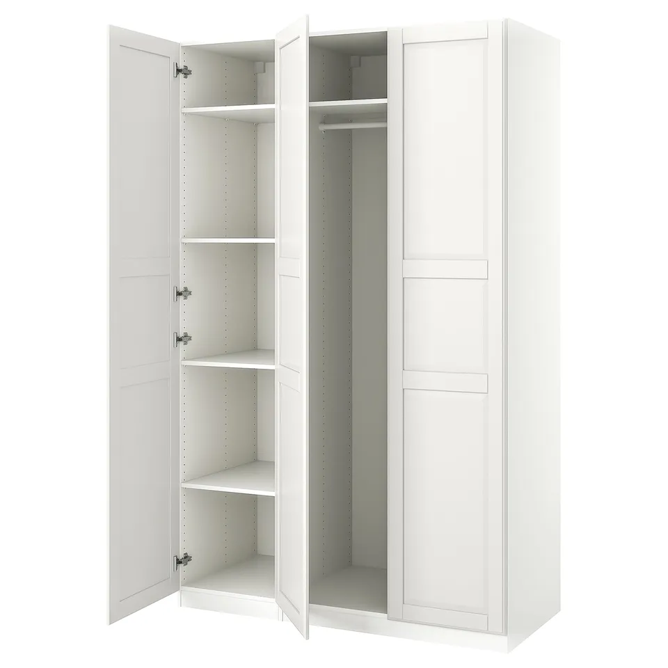White PAX wardrobe with open doors, white interior, shelves, and hanging rail.