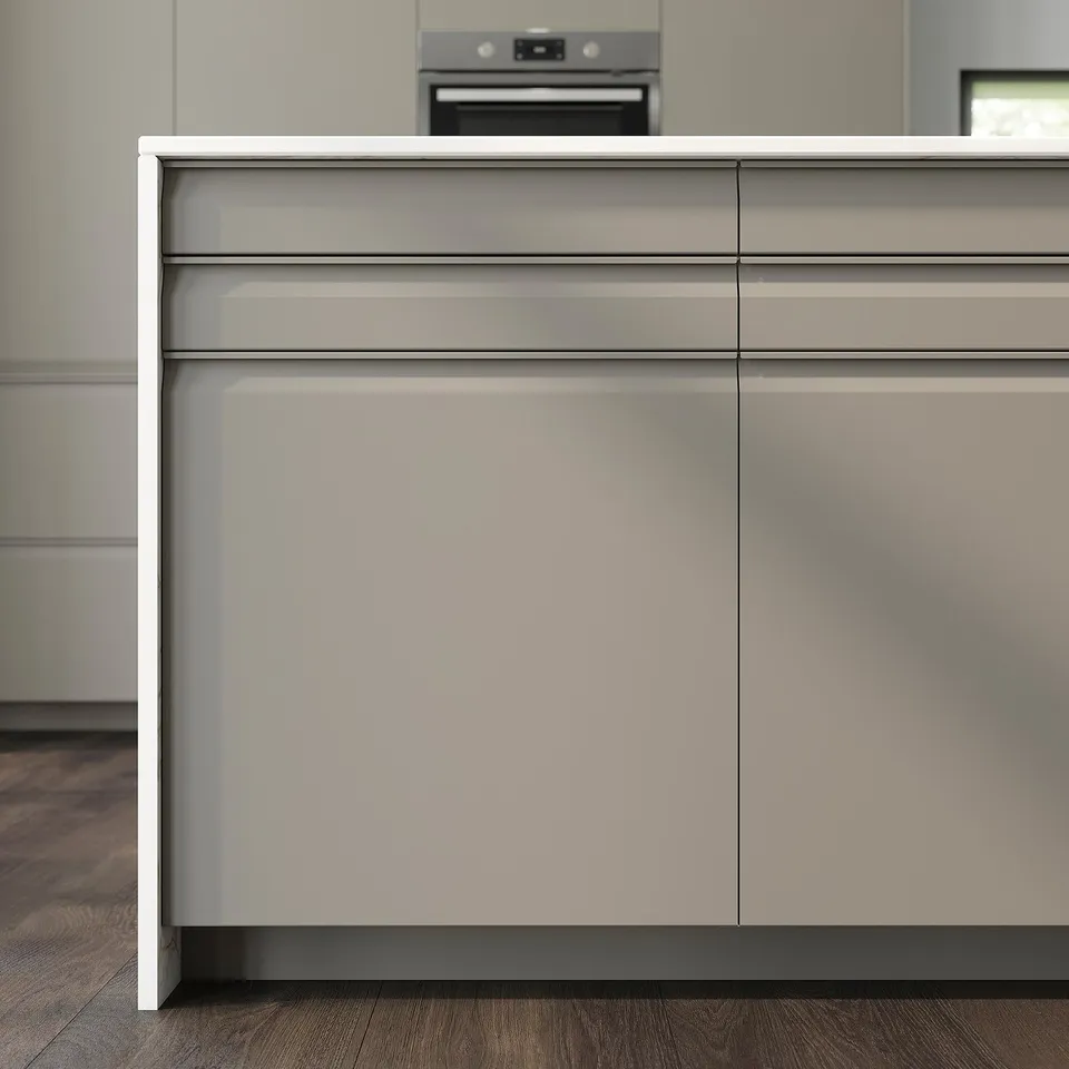 Modern kitchen with matt beige UPPLÖV cabinets, chamfered edges, and integrated handles. Sleek, minimalist design.
