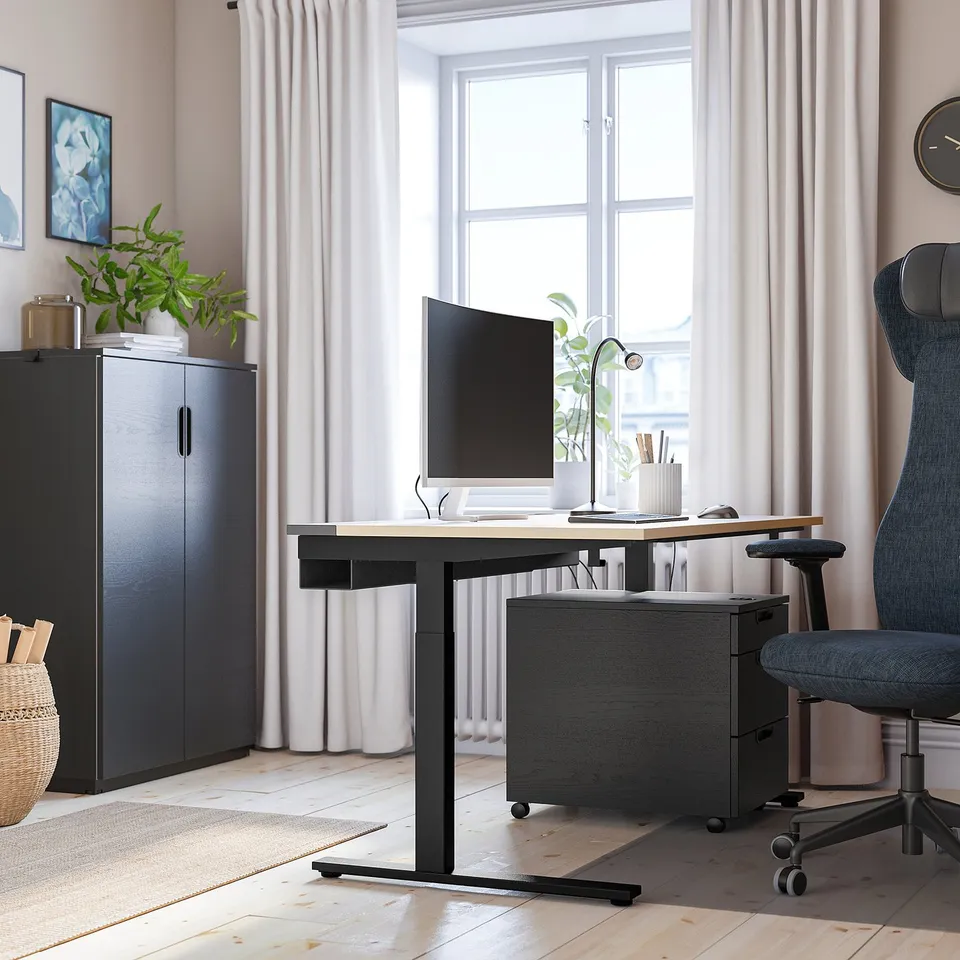 Home office with MITTZON desk, chair, & essentials.