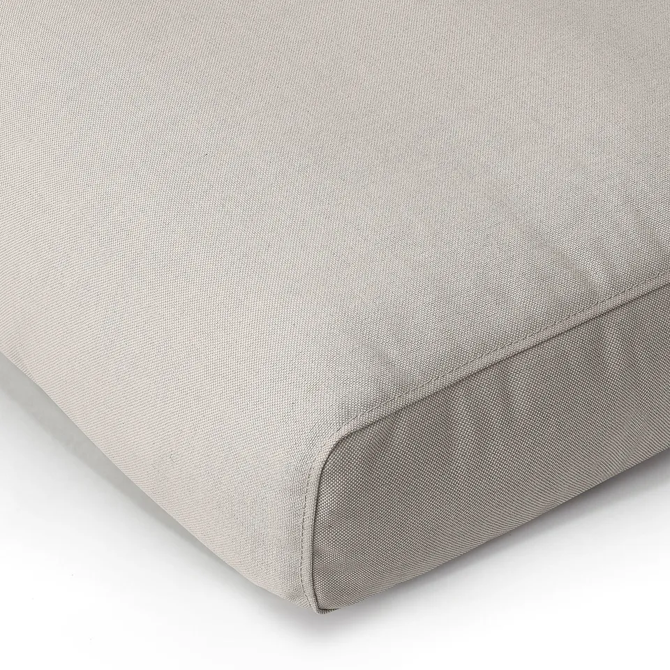 Soft, light grey cushion with smooth, even fabric. Slightly curved edges. High-quality, eco-friendly materials.