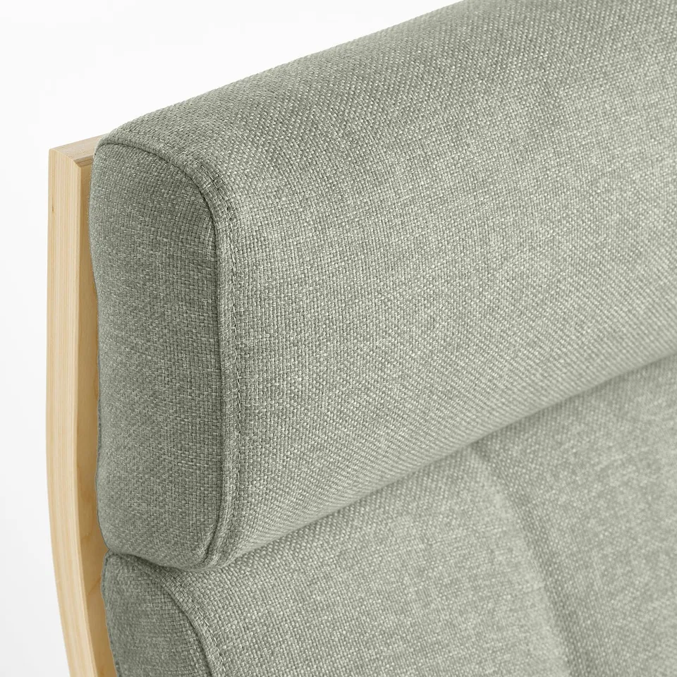 Close-up of POÄNG armchair, showing high-quality, curved bentwood and plush, textured gunnared fabric.