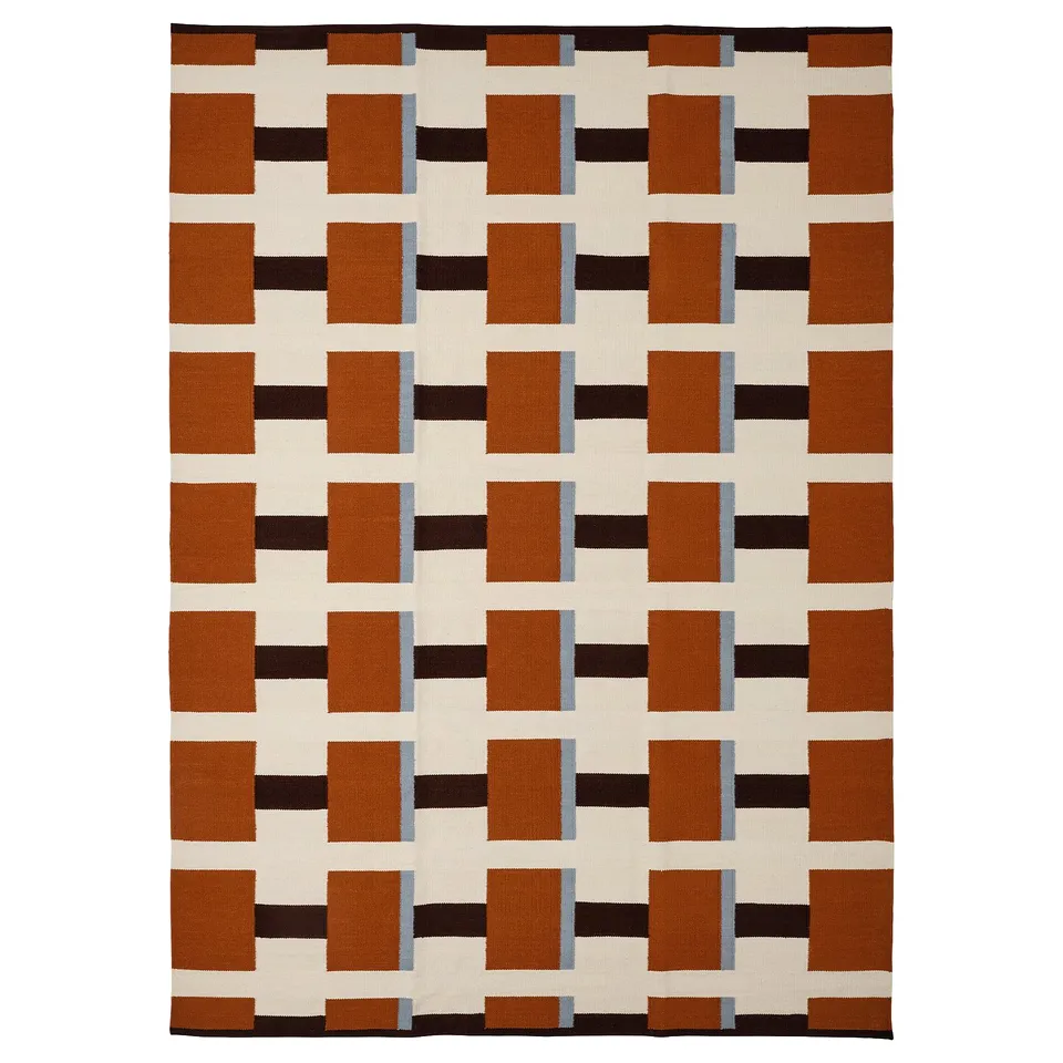 STOCKHOLM 2025 rug, geometric brown/white/black pattern, handwoven wool and cotton, rectangular, reversible.