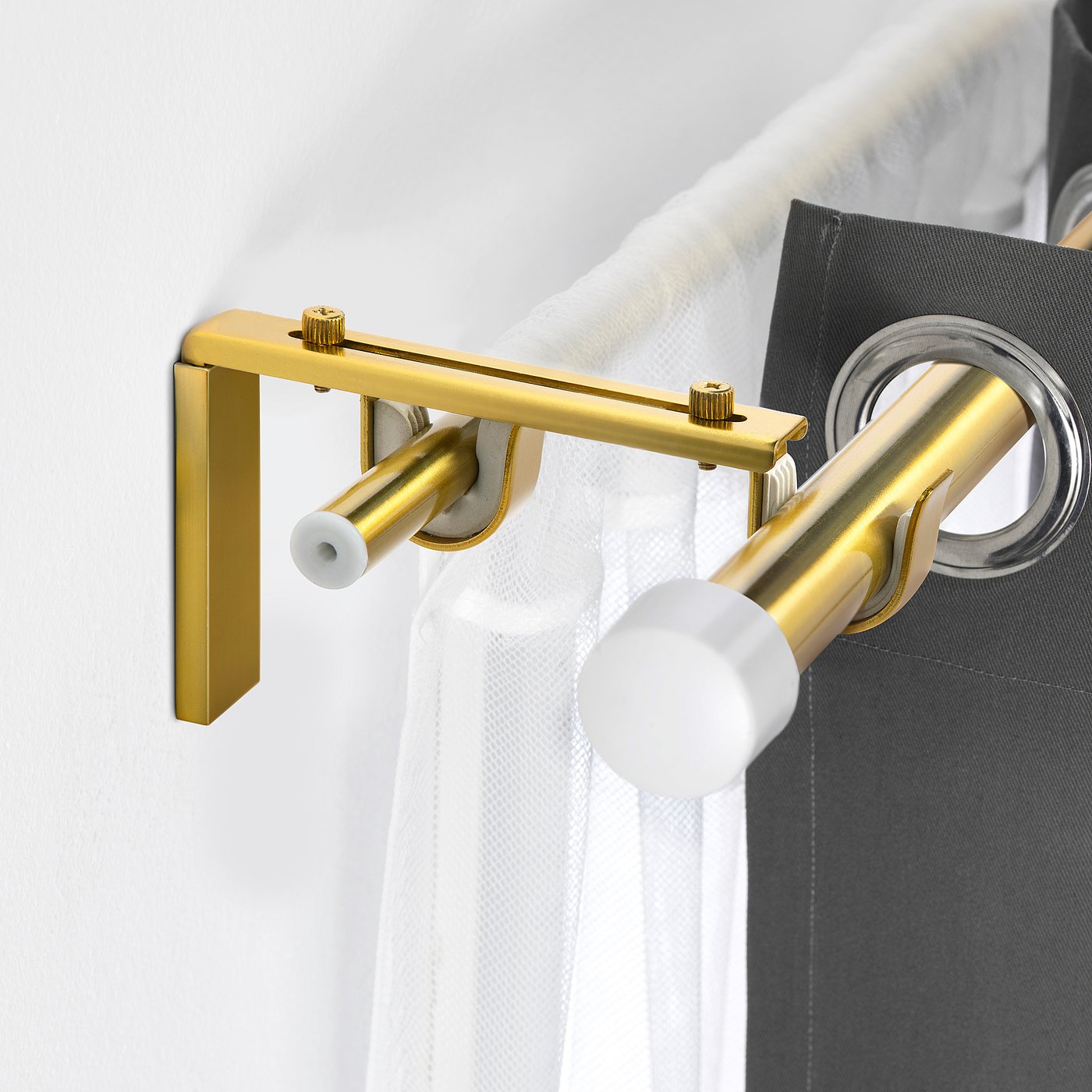 Gold BETYDLIG curtain rod holder with white liners, adjustable for wall or ceiling, close or away from windows. Small, stylish design.