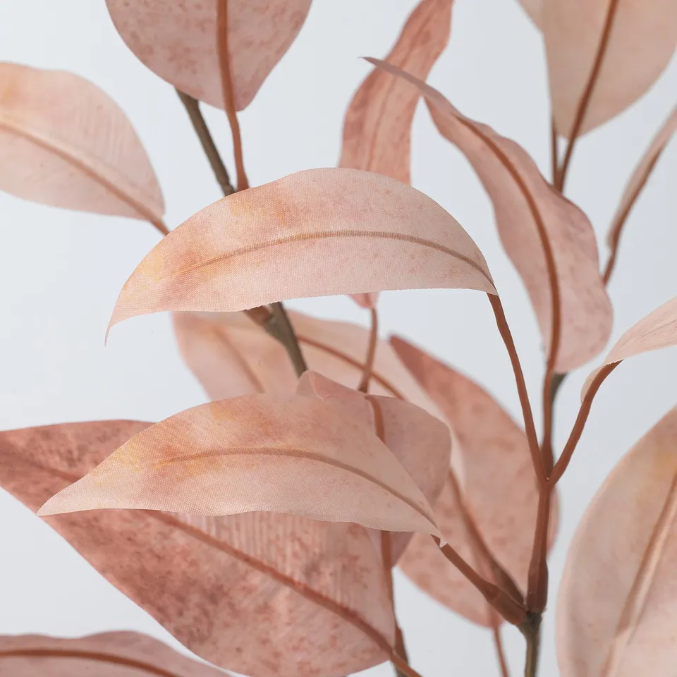 Artificial plant with realistic, soft pink leaves and flexible brown stems, made from recycled materials.