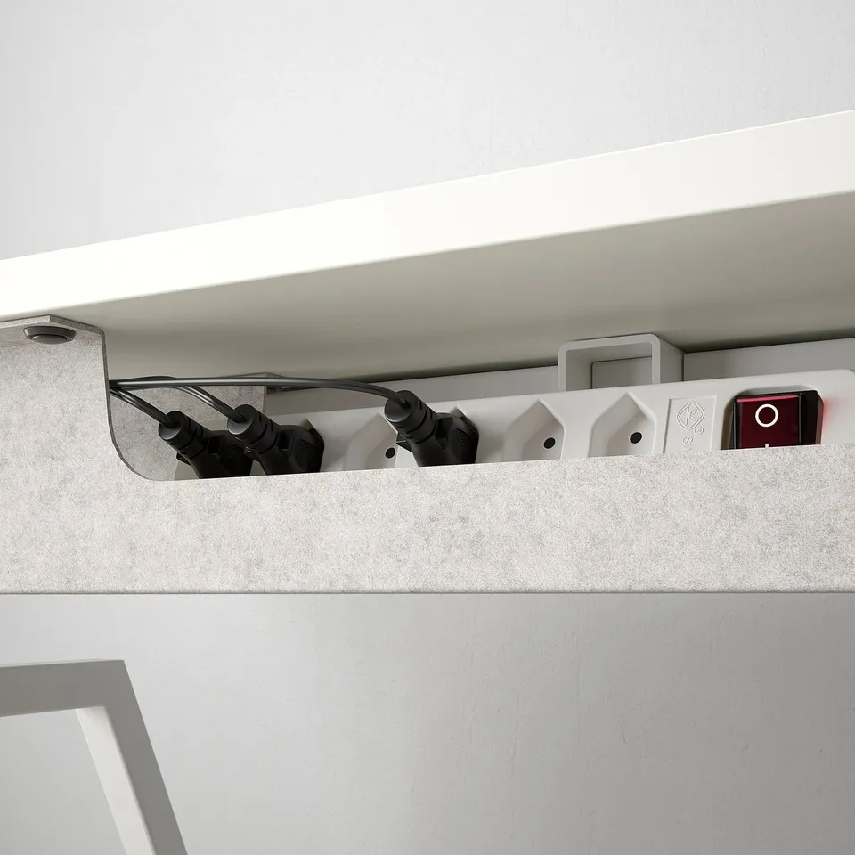 Desks cable management tray organises cords, maintaining a tidy workspace, with safety like child lock.