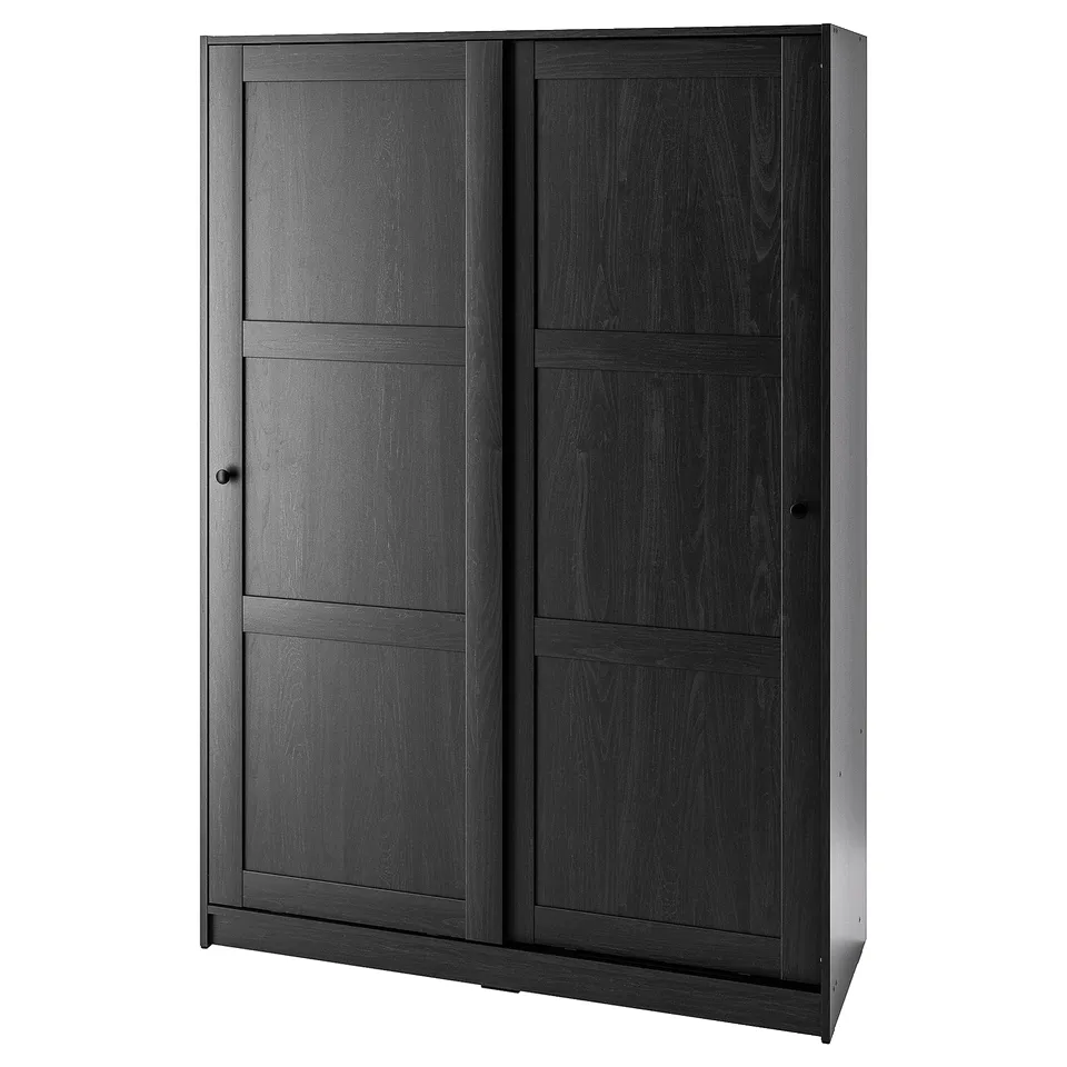 A RAKKESTAD wardrobe, dark grey, with sliding doors and minimalist design.