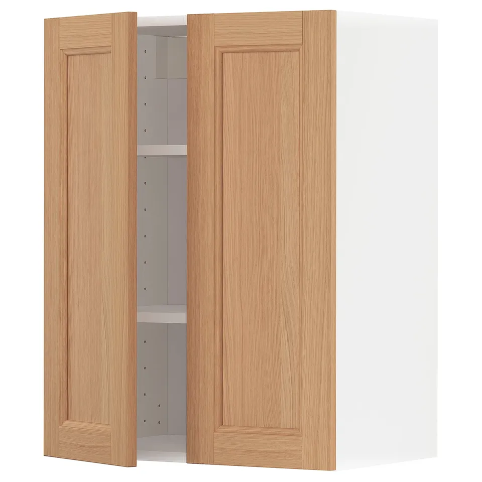 A light brown wooden kitchen cabinet with one door open, revealing an adjustable shelf inside.