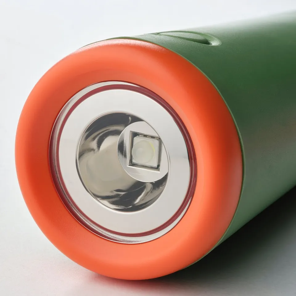 Close-up of green MAJBAGGE torch, featuring bright led and corrosion-resistant metal.