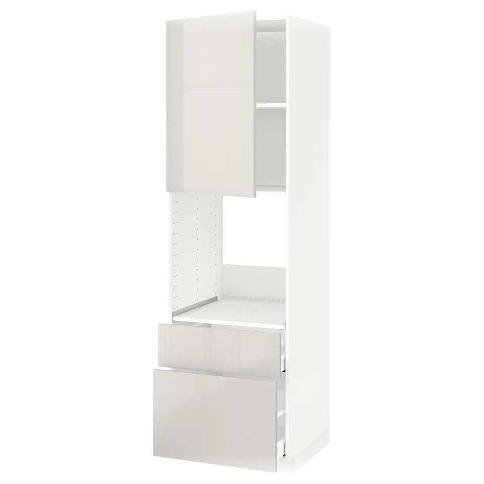 A white high cabinet from IKEAs METOD kitchen system. The cabinet high gloss finish, two drawers, and adjustable shelves.
