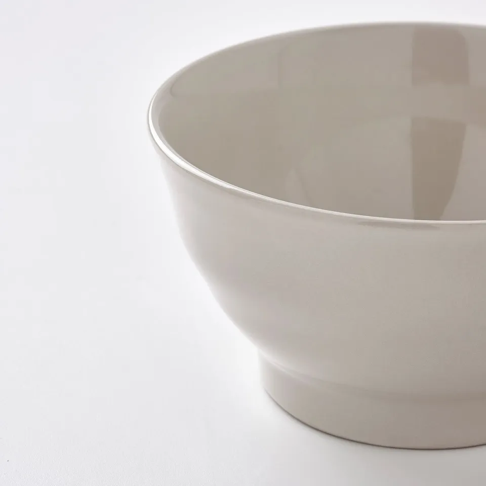 White bowl, smooth, glossy, round edges. Sturdy, well-made.