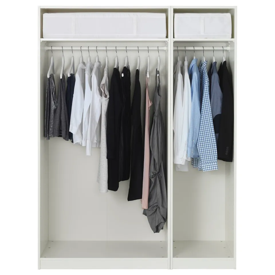 Open wardrobe with clothes hangers, various shirts and jackets neatly arranged, and shelves above.