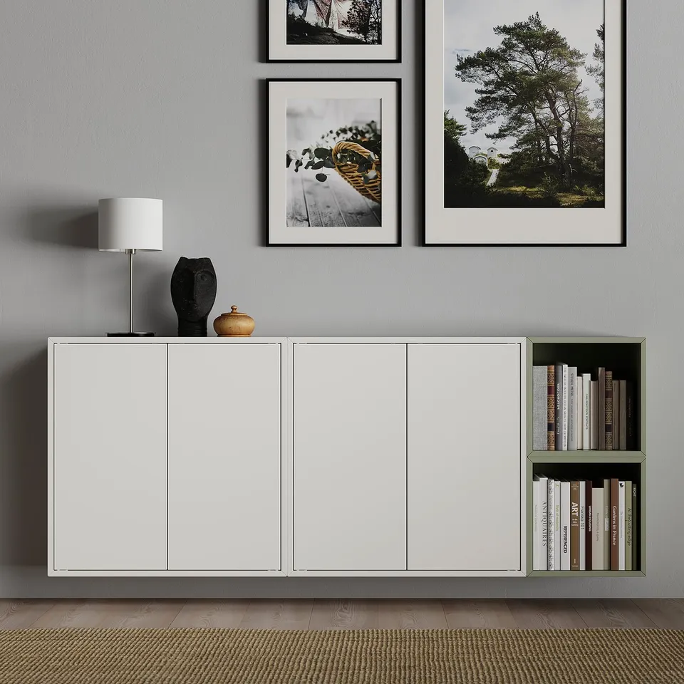 Modern living room with EKET storage, books, decor on grey walls.