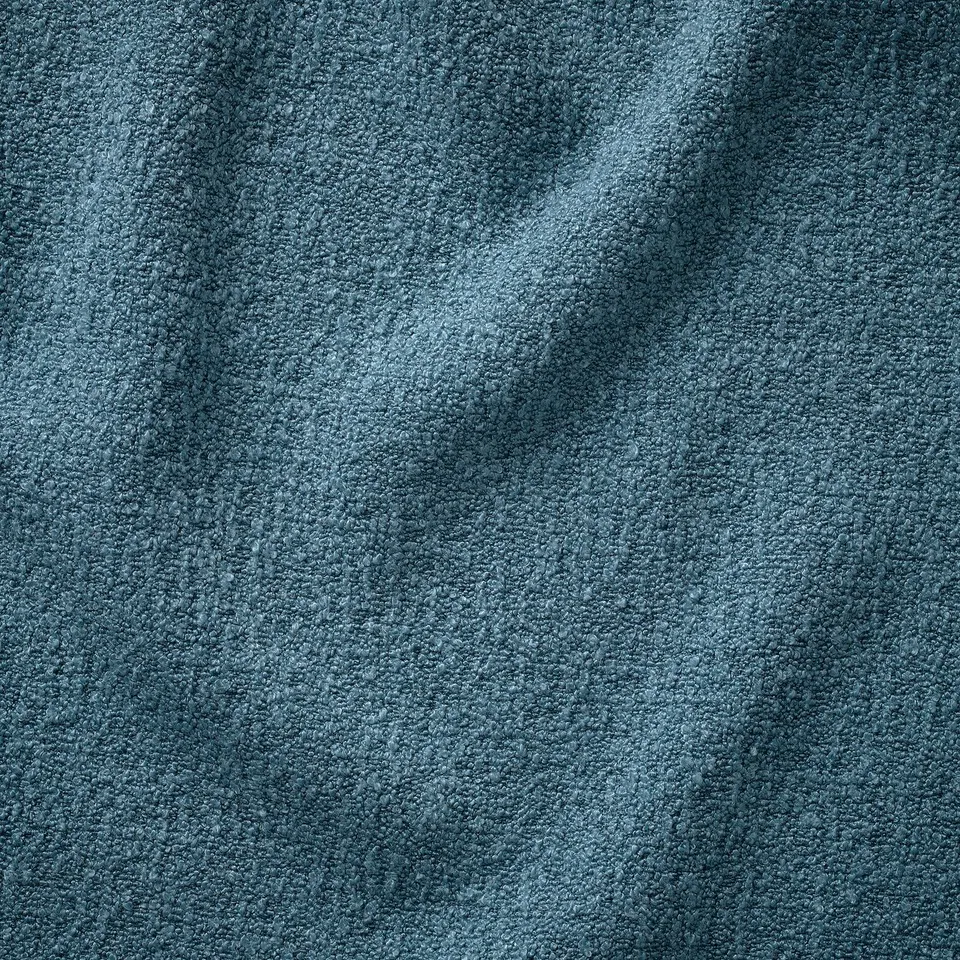 Soft, textured blue fabric close-up, showcasing high-quality, recycled bouclé material.
