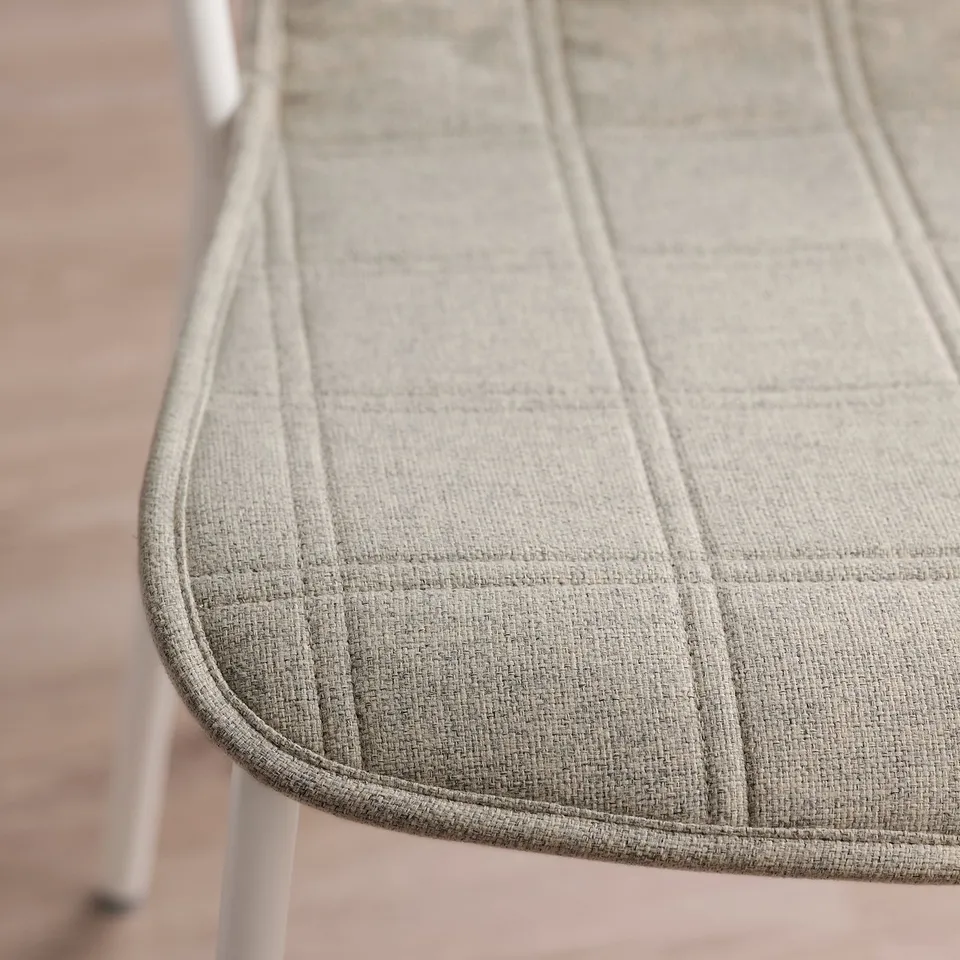 Close-up of high-quality conference chair seat. Soft, durable fabric cover with neat stitching, designed for comfort and easy cleaning.