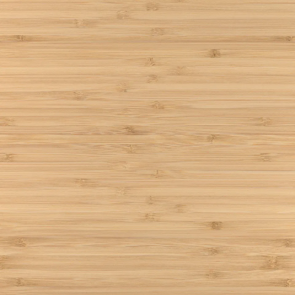 Close-up of a smooth, light bamboo surface. Shows natural grain texture and uniform finish.