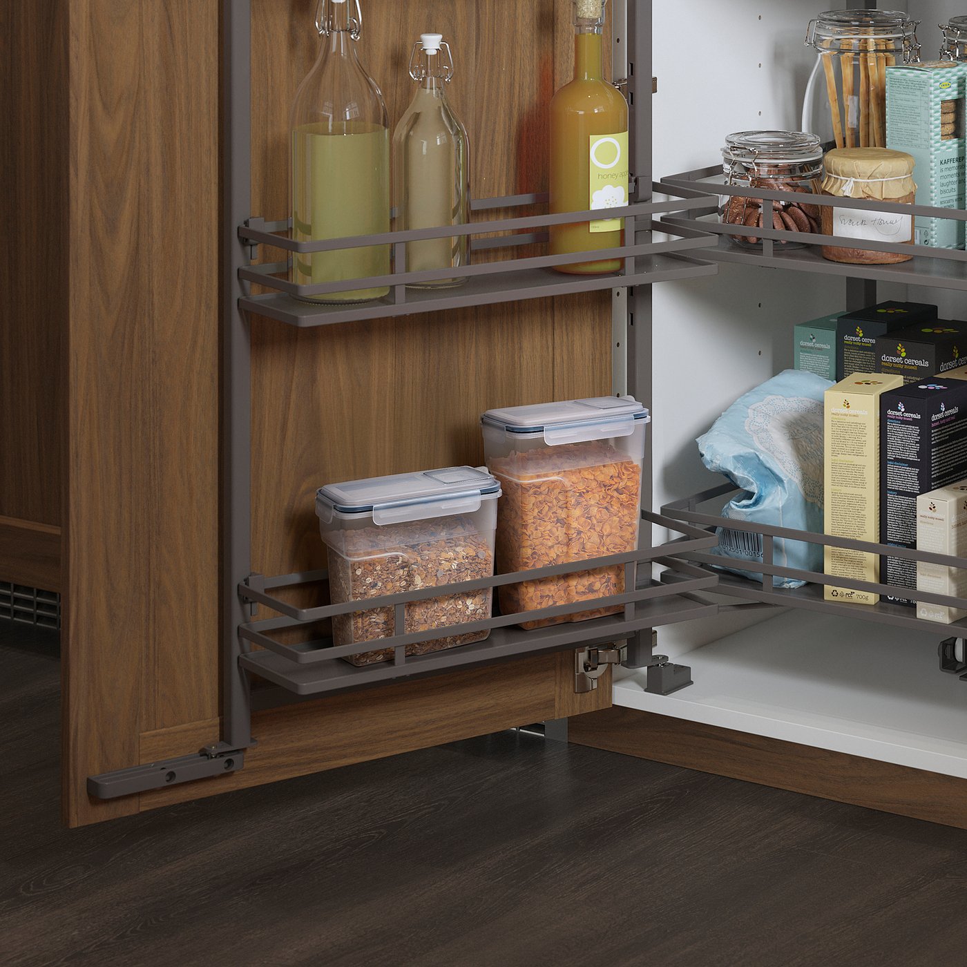 Kitchen cabinet with pull-out shelves and organised IKEA jars and bottles.
