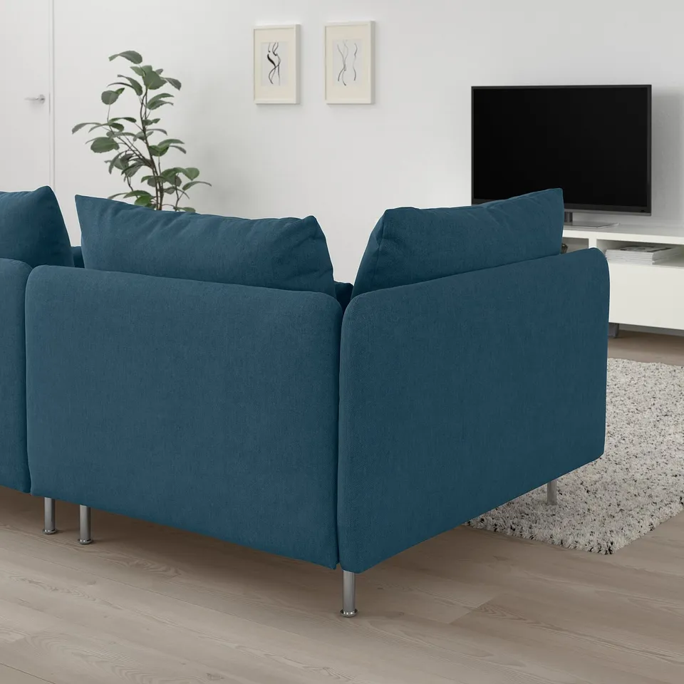 SÖDERHAMN teal sofa, modern low design, spacious, with dark blue cushions. A large, comfortable centrepiece in the room.