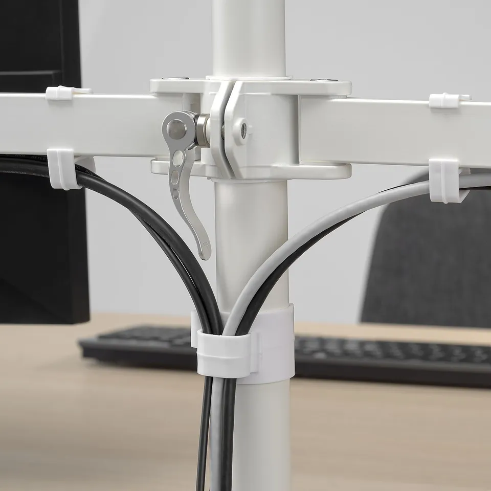 Clamp system for mounting screens, organised cables with white clips, sturdy design.