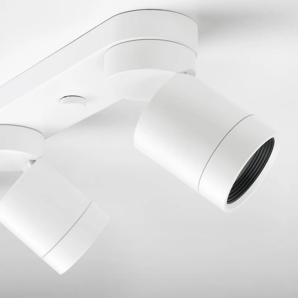 Modern white ceiling spots. Three adjustable lights in sleek design.