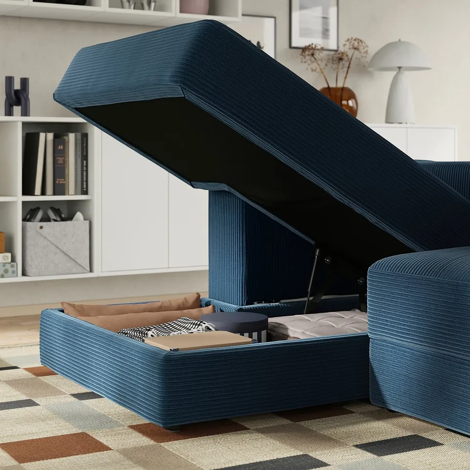 Modern modular sofa with storage. Open chaise longue reveals plush cushions and ample space for bedding or blankets.