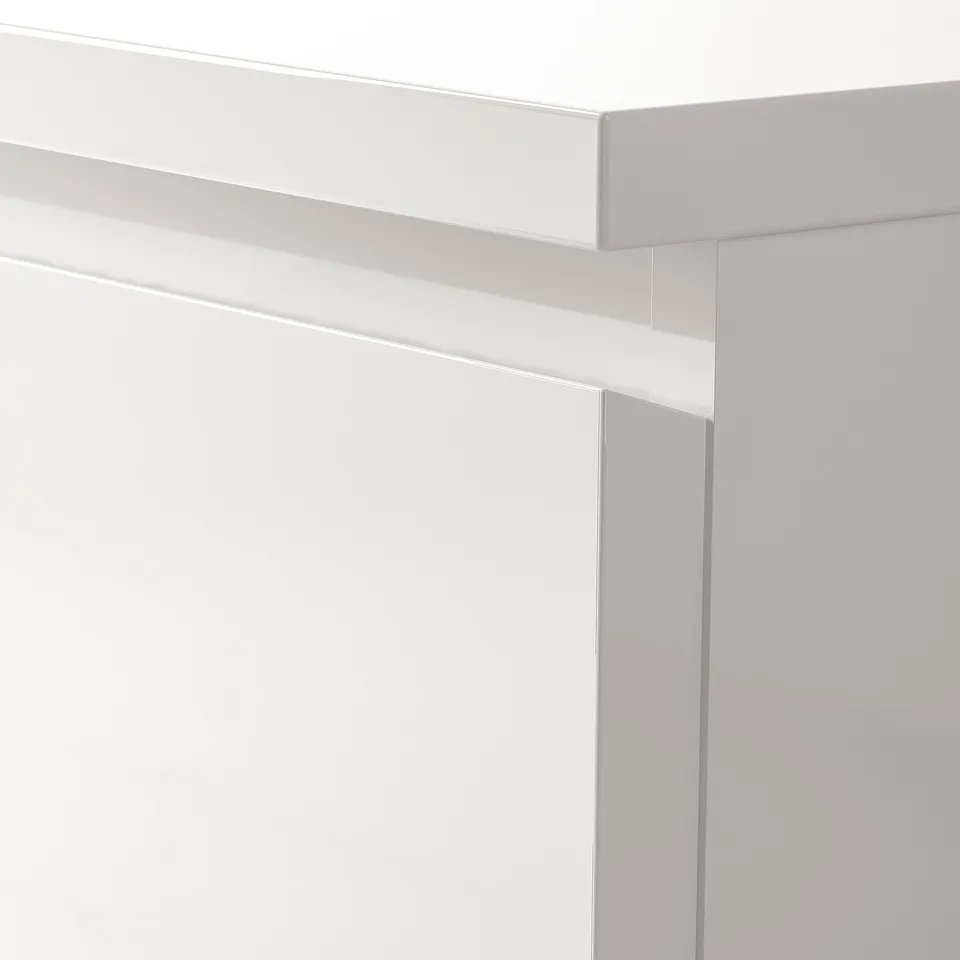 Minimalist white MALM chest with sleek & smooth edges, quality construction, ready for wall mounting.