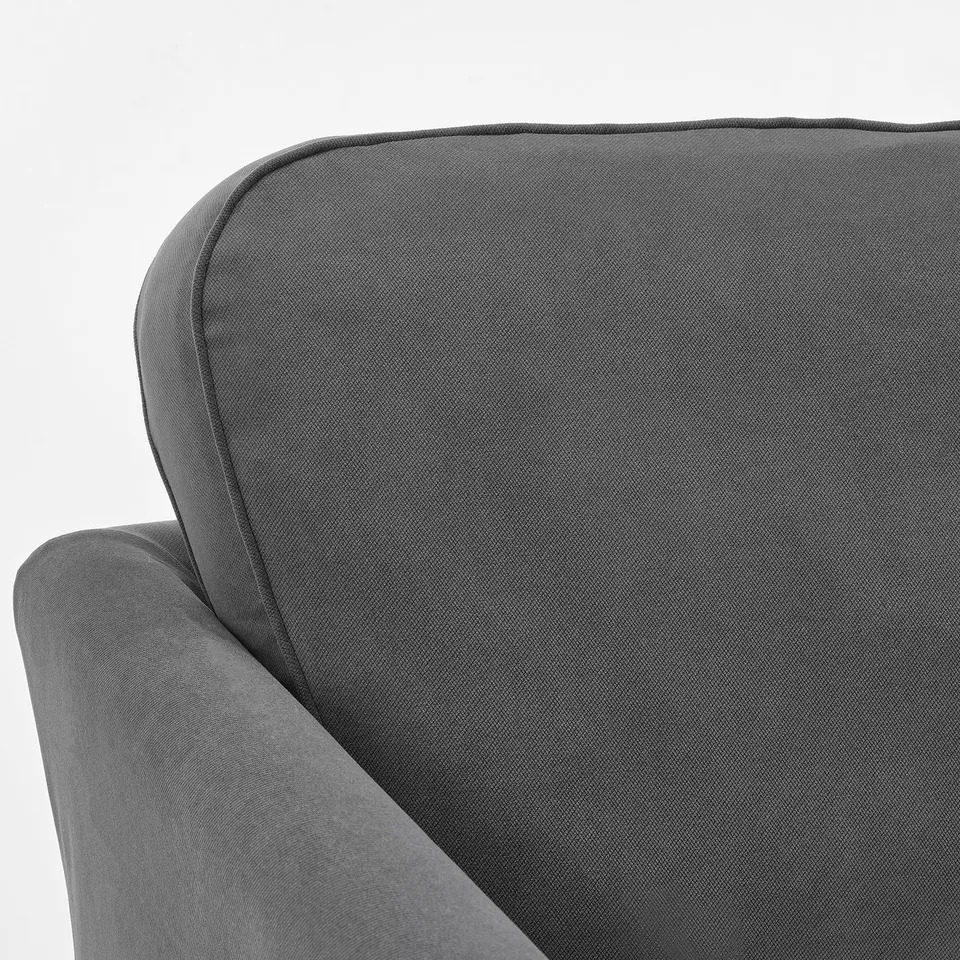 Modern grey sofa corner, sleek design with smooth, textured upholstery, showcasing quality craftsmanship.