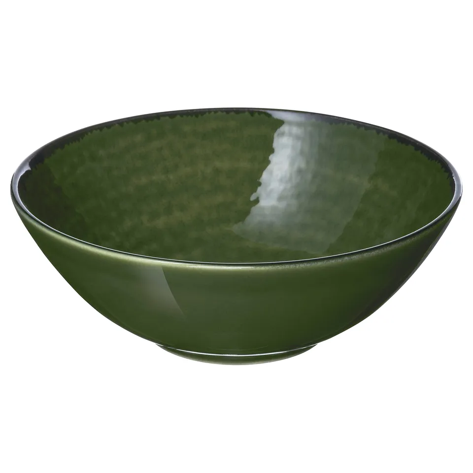 Green ceramic bowl, glossy finish, dark rim, simple design.
