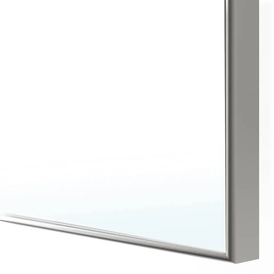 A close-up of a sleek, modern mirror edge, with a clean, polished finish.
