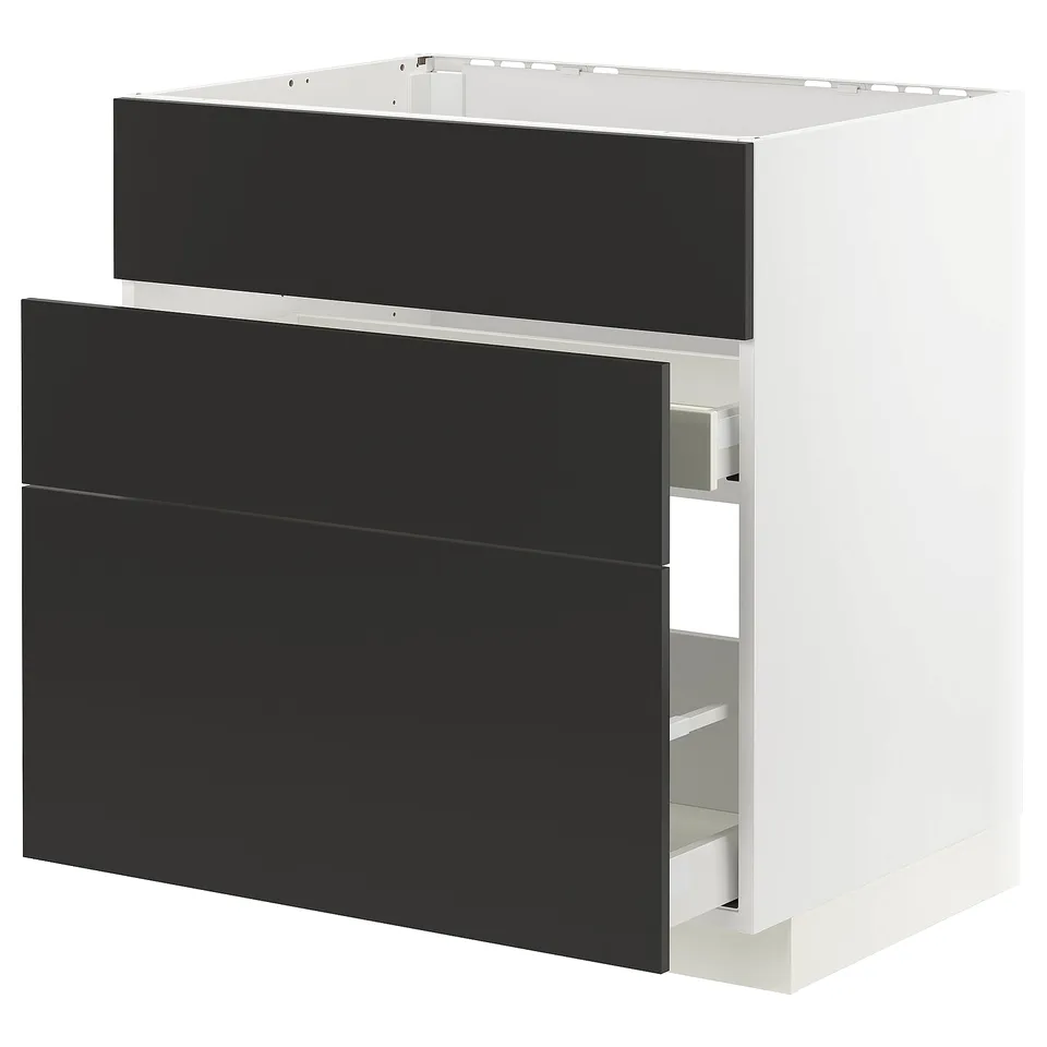 A modern black-and-white kitchen cabinet from IKEAs METOD line with black drawers and a white base.