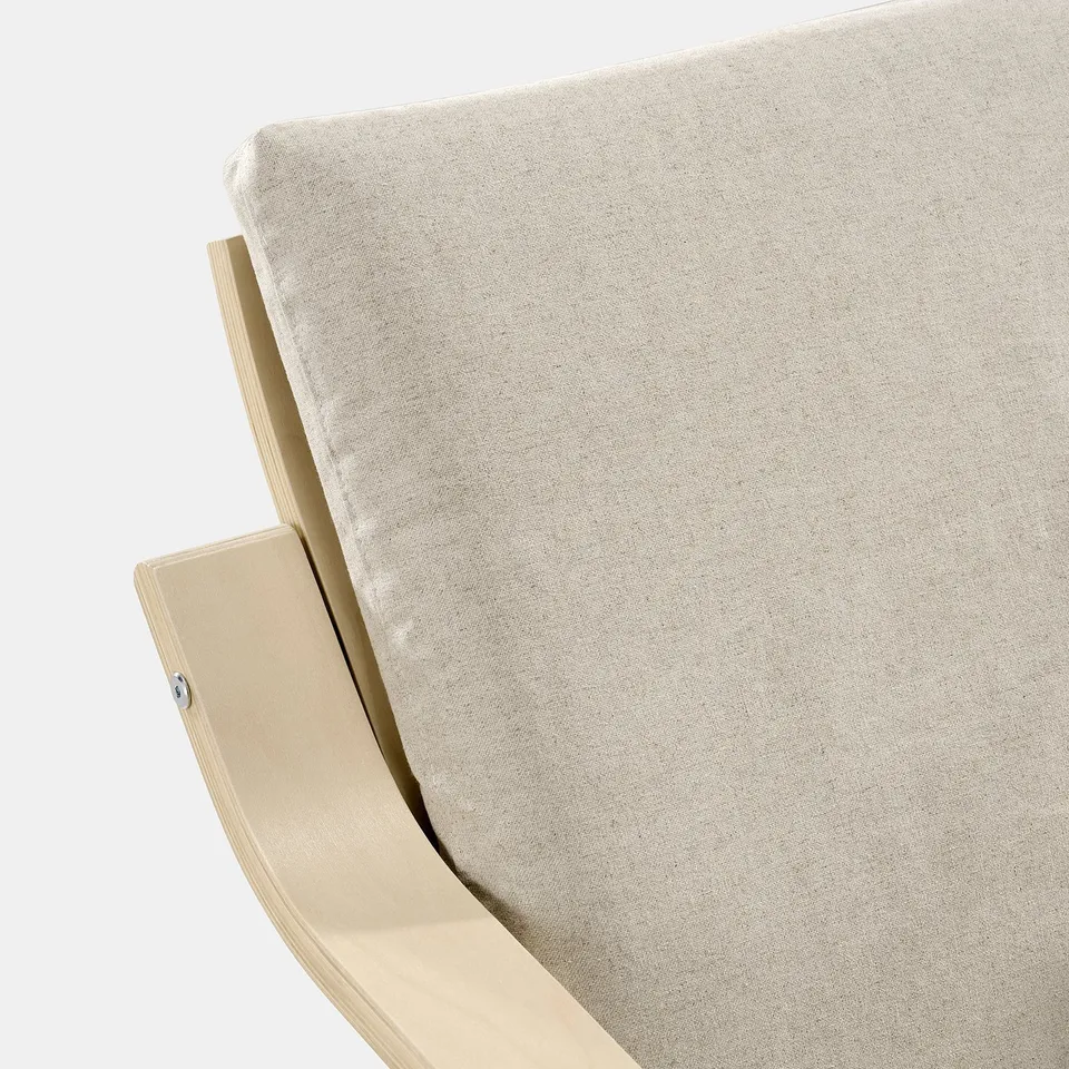 A close-up of a beige POÄNG armchair, showcasing its curved wooden frame and plush, textured fabric, highlighting its comfort and modern design.