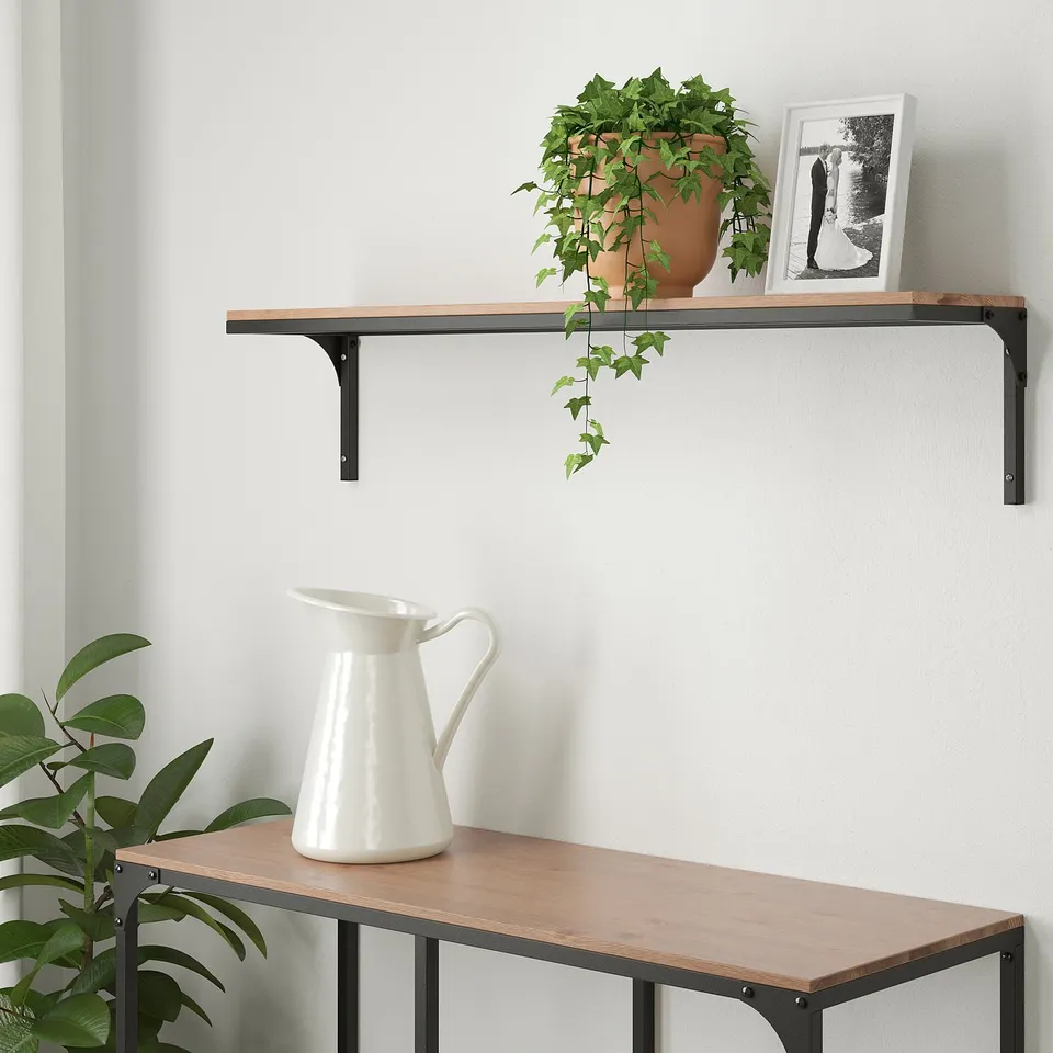 FJÄLLBO shelf with plant & photo, bench below with pitcher.