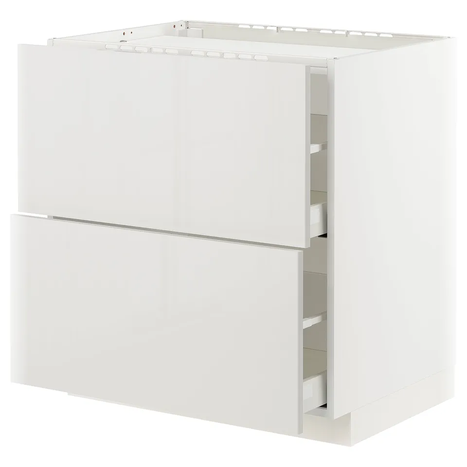 A white METOD kitchen cabinet with a modern, glossy finish and integrated drawers.