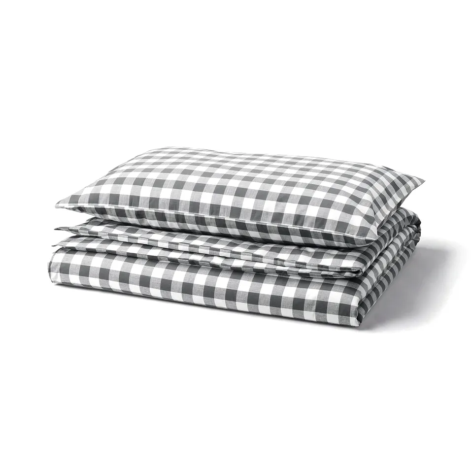 Folded black and white gingham duvet set, rectangular, organic cotton.