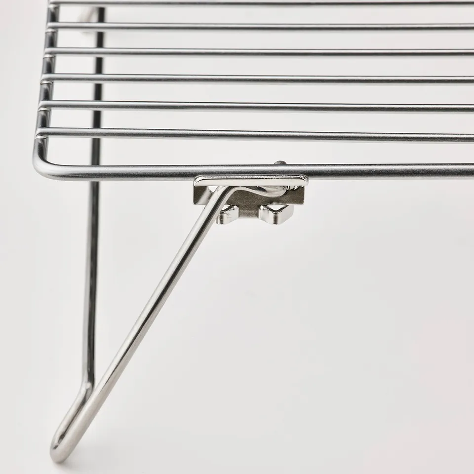 Depicts a close-up of a high-quality stainless steel wire rack, showcasing its sturdy construction and polished finish.