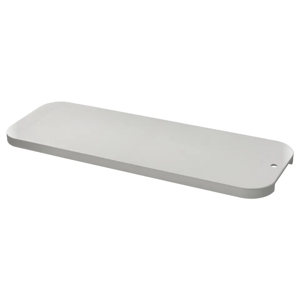 White LILLHAVET chopping board, flat and rectangular.