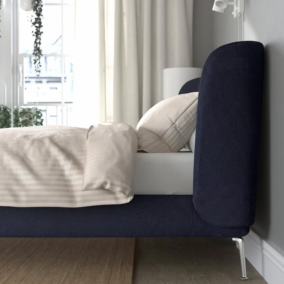 Modern bed with curved, padded headboard for comfort. Slatted base for airflow, adjustable sides for mattress thickness.