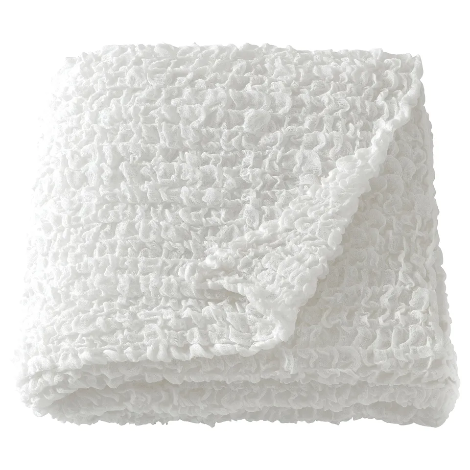 OFELIA white recycled polyester throw blanket, soft & stretchy, folded.