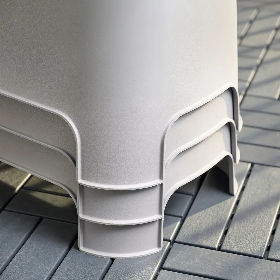 White ASPAREN stacked planters on a deck. Modern design, robust plastic.