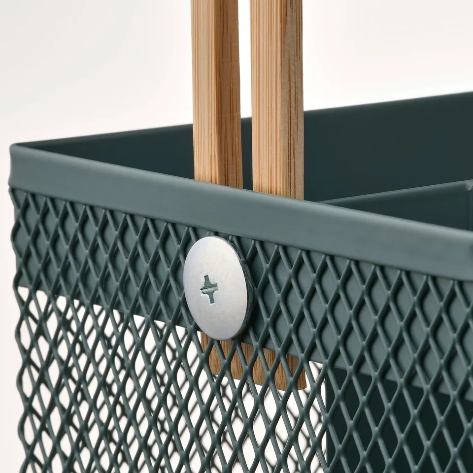 Dark green metal basket with bamboo handles, showing sturdy build and mesh design.
