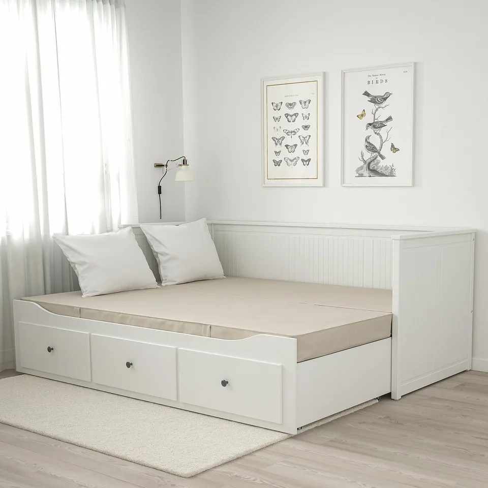 Small space VANNAREID bed with drawers, pocket springs, art prints, and lamp.