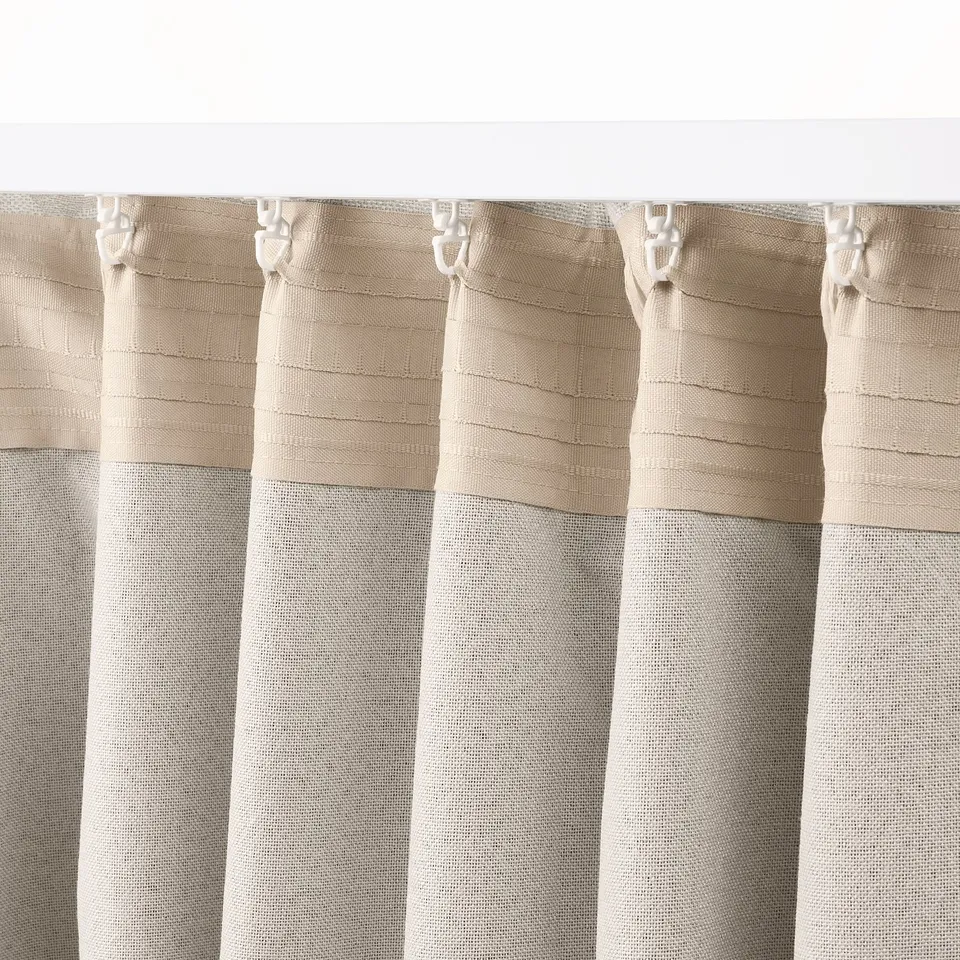 Beige LÖNNSTÄVMAL curtains with jacquard weave, hooks, and heading tape.