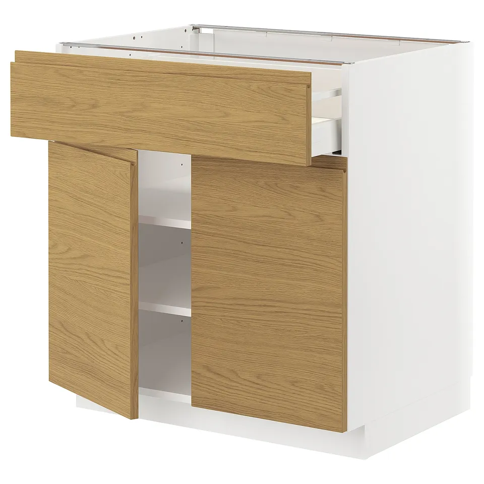 METOD kitchen cabinet with light wood finish, featuring a drawer and shelves. Modern minimalist design with integrated handles.