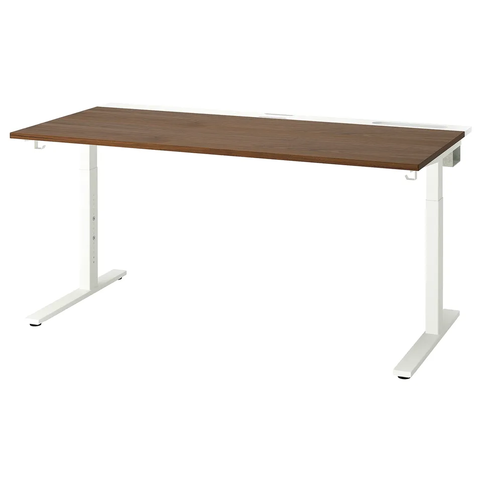 IKEA MITTZON adjustable standing desk in walnut and white. Smooth rectangular top, sturdy clean design.