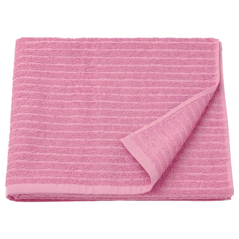 Bright pink folded towel, soft & absorbent, ribbed texture, rectangular shape & clean edge, plain design. VÅGSJÖN.