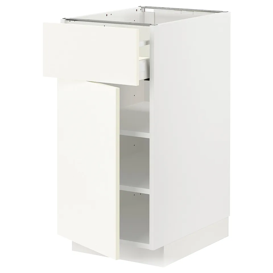 A white METOD kitchen cabinet with one door and two shelves open, revealing the interior. Its rectangular with clean lines and a modern design.
