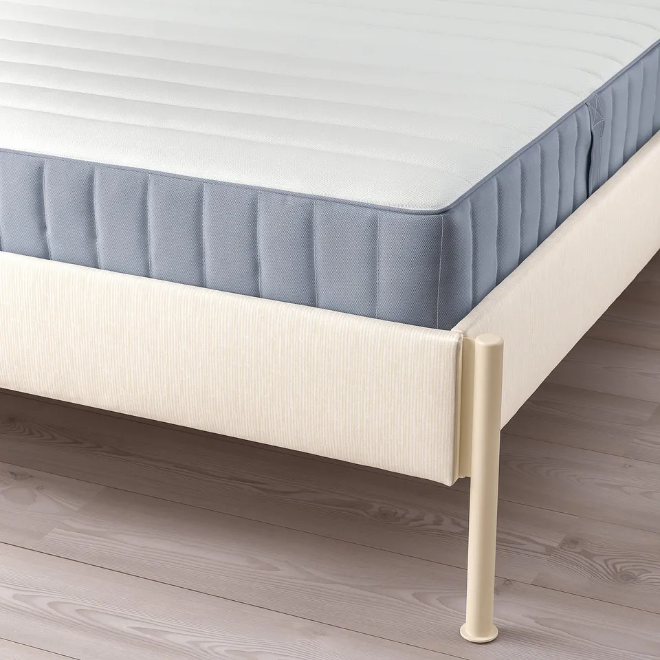 Modern bed frame with adjustable sides, comfy headboard, supporting mattress. Light beige and grey.